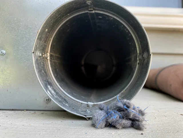 Eastlake Dryer Vent Cleaning technician using specialized equipment to clear severe dryer vent blockage in Eastlake